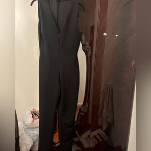 Women’s black v neck jump suit. Zara